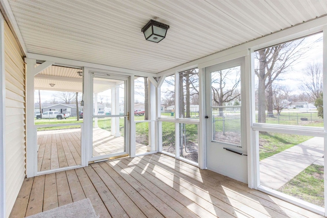 unfurnished sunroom with a healthy amount of sunlight