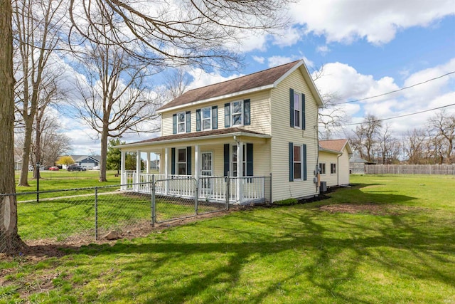 view of front facade with covered porch and a front yard