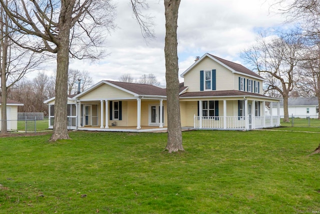 view of front facade with a front lawn and covered porch