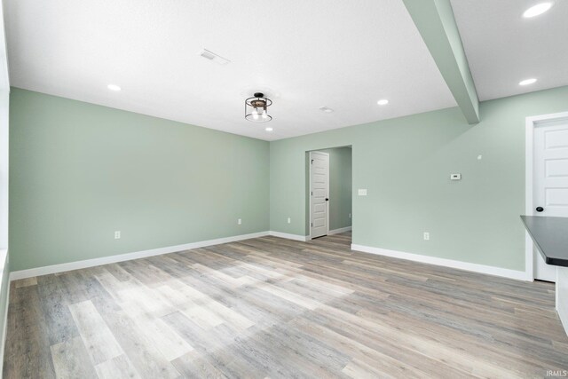 3615 Lindbergh Blvd, Fort Wayne, IN 46806 - spare room featuring recessed lighting, baseboards, light wood-style flooring, and beam ceiling