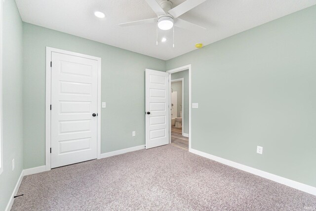 3615 Lindbergh Blvd, Fort Wayne, IN 46806 - unfurnished bedroom featuring light carpet, baseboards, a ceiling fan, and recessed lighting