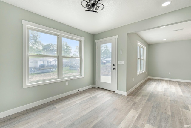 3615 Lindbergh Blvd, Fort Wayne, IN 46806 - doorway with light wood-style flooring, baseboards, a chandelier, and recessed lighting