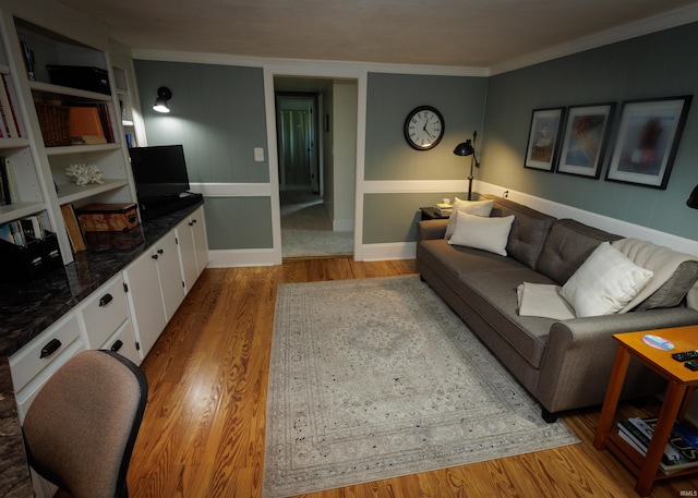 living room featuring crown molding and hardwood / wood-style flooring