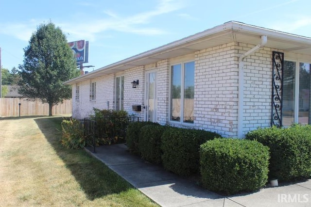 ranch-style house with a front lawn