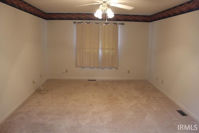 spare room with ceiling fan and carpet floors