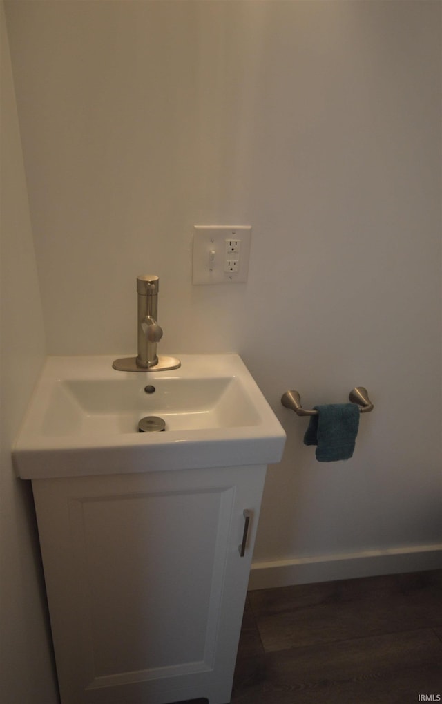 bathroom with vanity and wood-type flooring