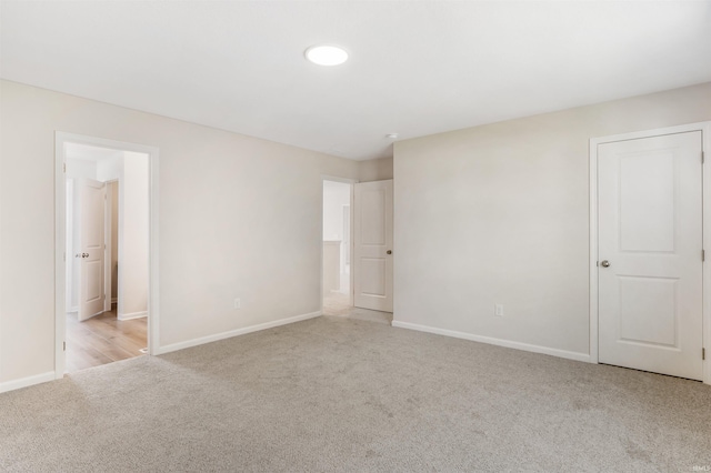 spare room with light colored carpet