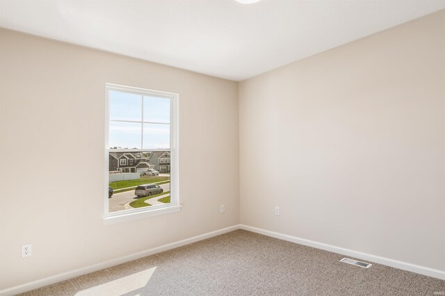 empty room featuring carpet floors