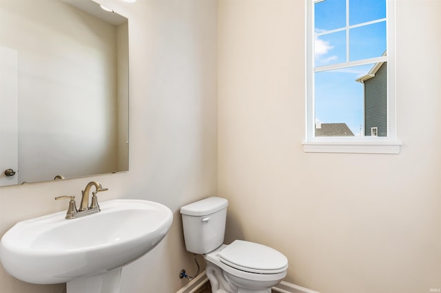 bathroom with toilet and sink