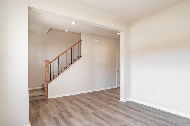 spare room featuring wood-type flooring