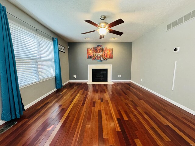 living room with dark hardwood / wood-style floors and ceiling fan