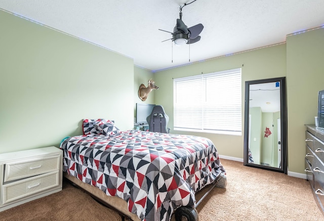 carpeted bedroom with ornamental molding, a textured ceiling, and ceiling fan