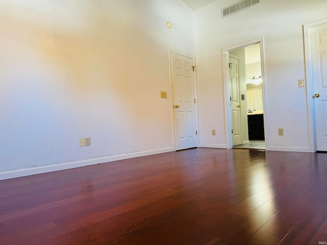 empty room featuring dark hardwood / wood-style flooring