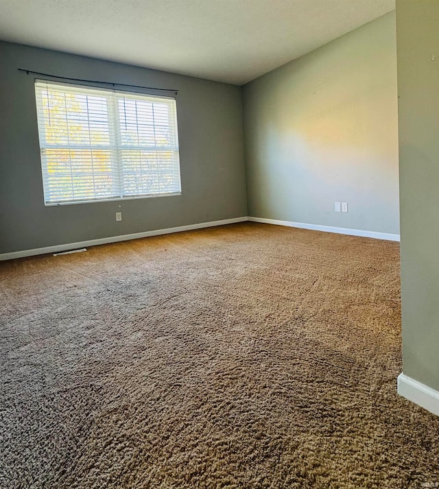 unfurnished room with carpet floors