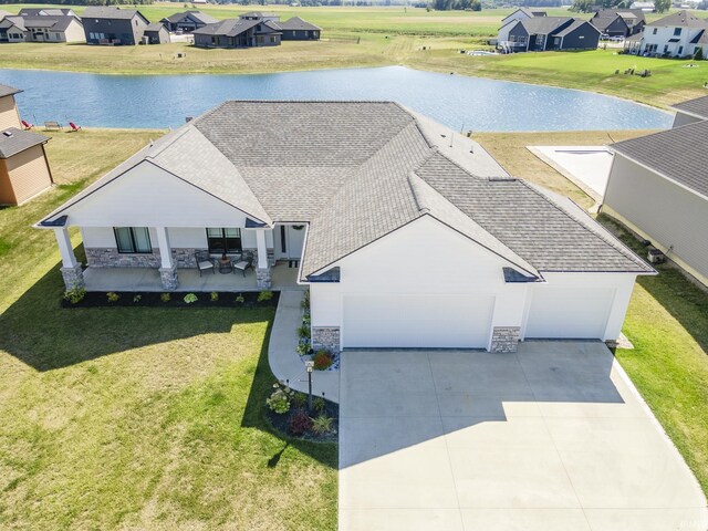 bird's eye view featuring a residential view and a water view