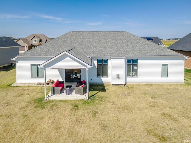 back of house with a yard and a patio area