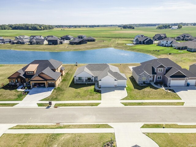 bird's eye view with a water view and a residential view