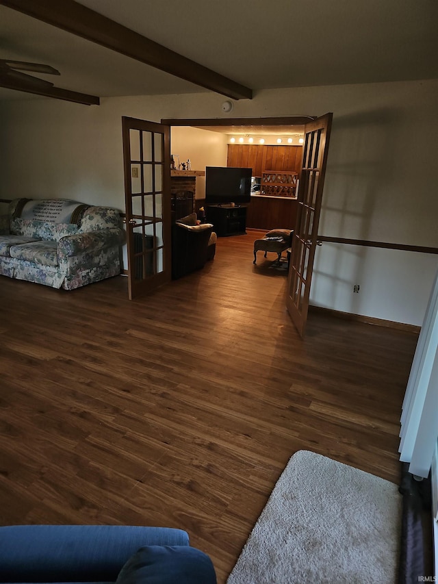 hallway featuring beamed ceiling and dark hardwood / wood-style flooring