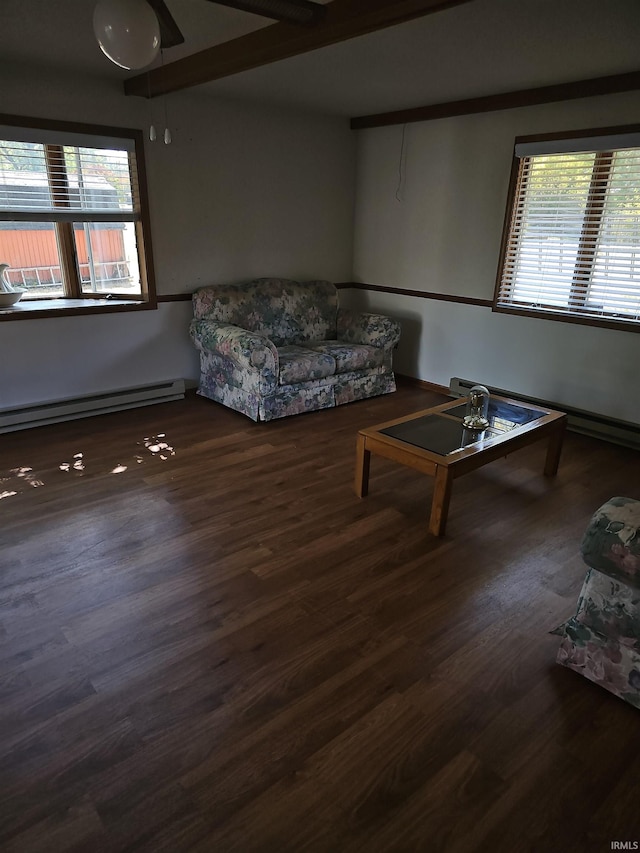 living room featuring a baseboard heating unit, dark wood-type flooring, and ceiling fan