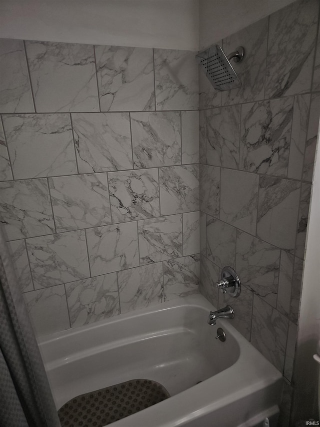 bathroom with shower / bathtub combination with curtain