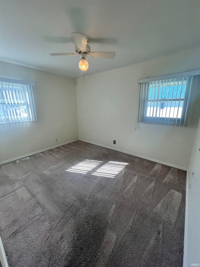 carpeted empty room with ceiling fan