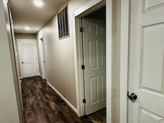 hallway with dark hardwood / wood-style floors