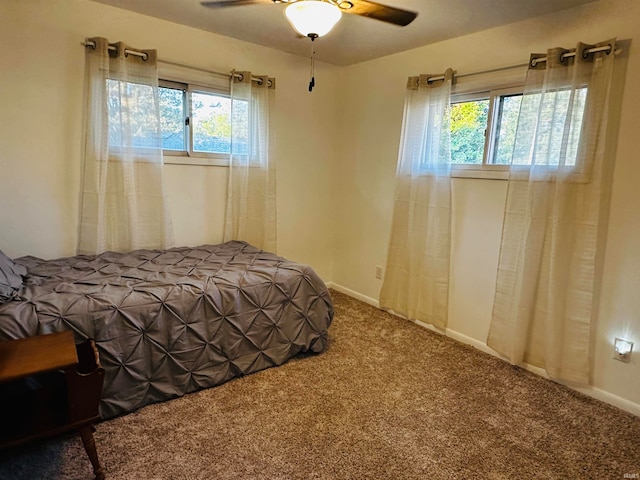 bedroom featuring ceiling fan and carpet floors