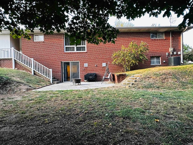 back of property with a patio area and central AC unit