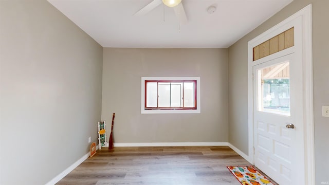 entryway featuring light wood-type flooring and ceiling fan