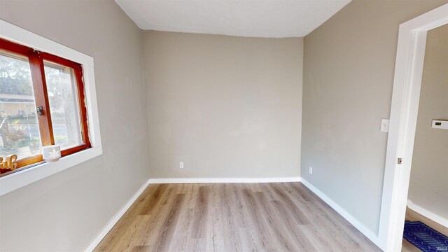 spare room with light hardwood / wood-style flooring