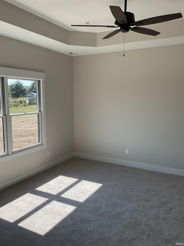 carpeted empty room with ceiling fan