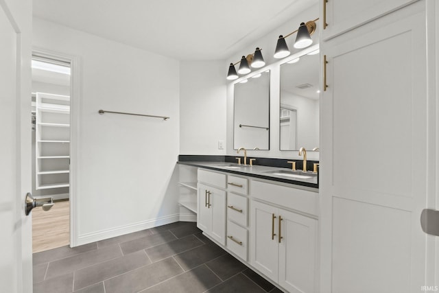 bathroom with vanity and tile patterned flooring