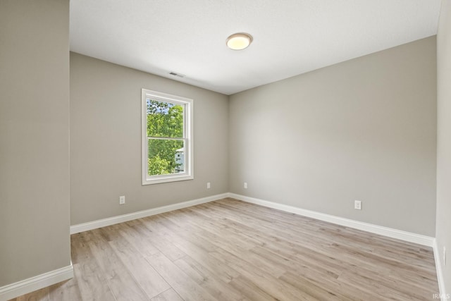 unfurnished room featuring light wood-type flooring