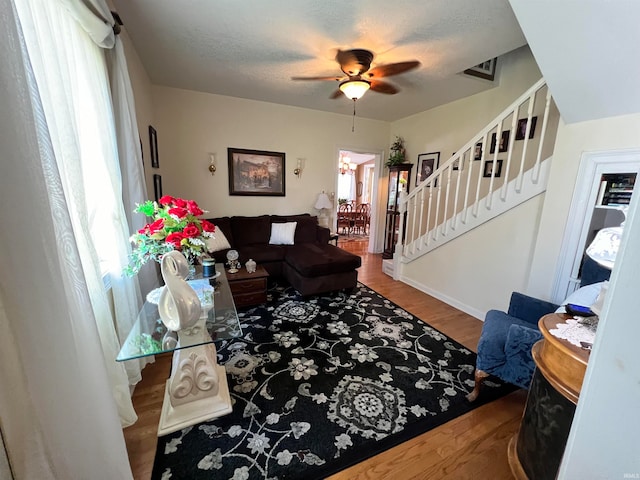 interior space with hardwood / wood-style floors, ceiling fan, and a wealth of natural light