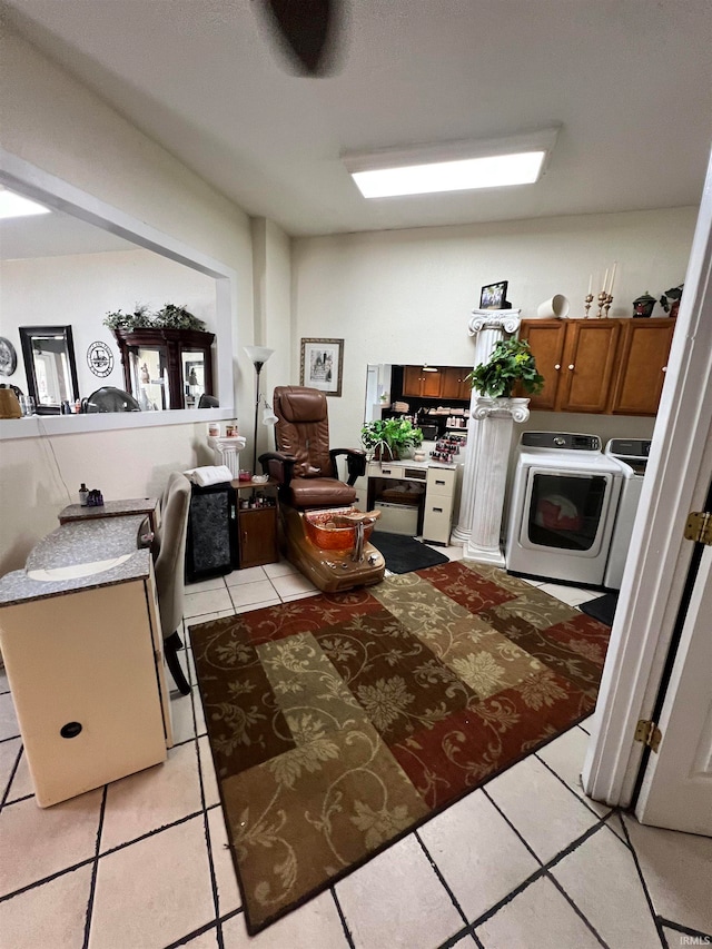 kitchen with washing machine and dryer and light tile patterned flooring