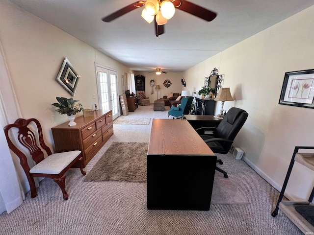 office with ceiling fan, light colored carpet, and french doors