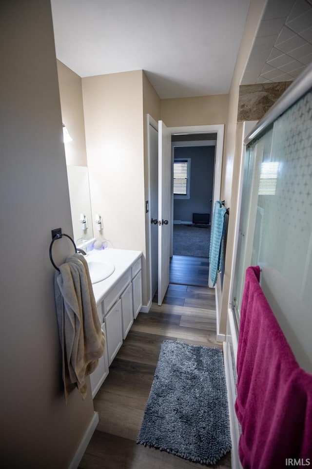 bathroom with vanity and hardwood / wood-style floors