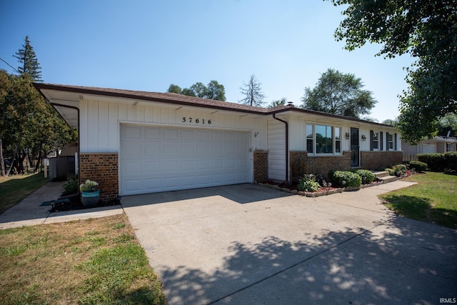 single story home featuring a garage