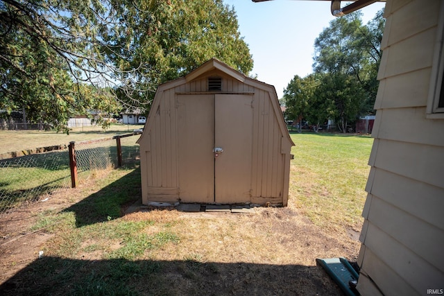 view of outdoor structure with a lawn