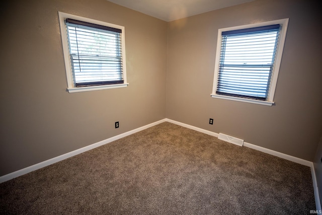 spare room featuring carpet