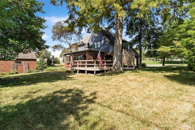 view of yard featuring a wooden deck