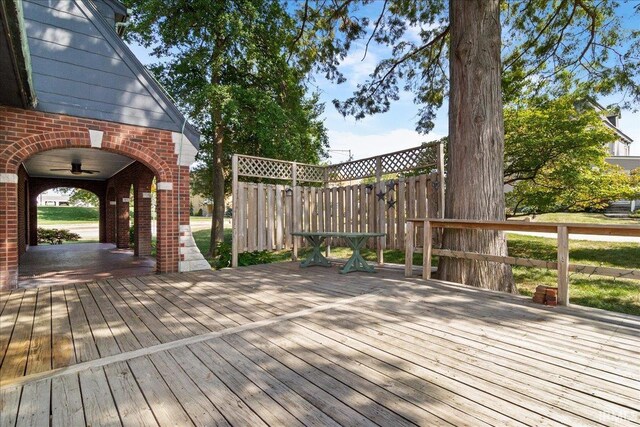 wooden deck with ceiling fan