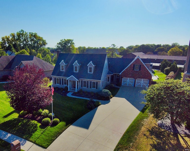 1509 Hawksview Dr, Marion, IN 46952 - cape cod house with a garage, driveway, a chimney, and a front lawn