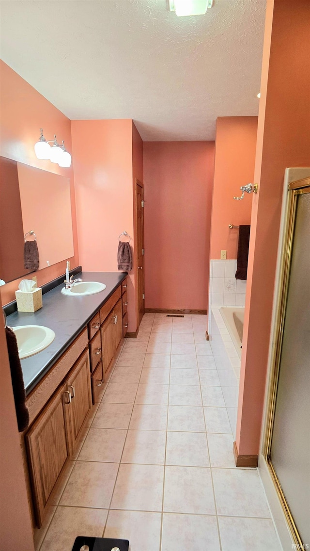 1509 Hawksview Dr, Marion, IN 46952 - full bath with a stall shower, a garden tub, a sink, and tile patterned flooring