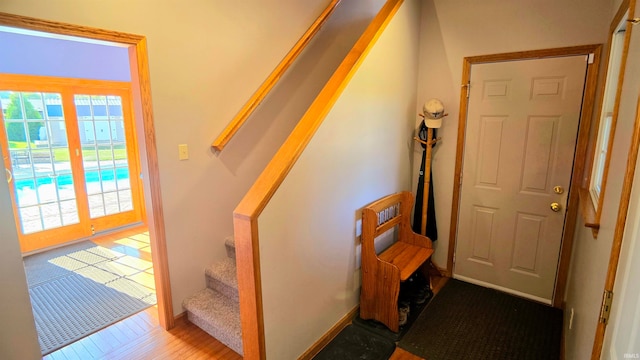 staircase featuring hardwood / wood-style flooring