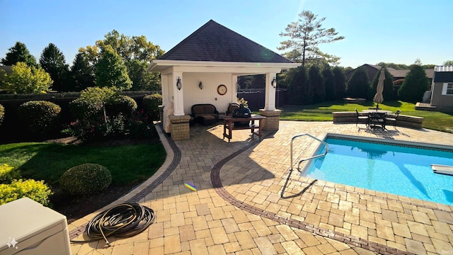 view of pool featuring a yard and a patio area