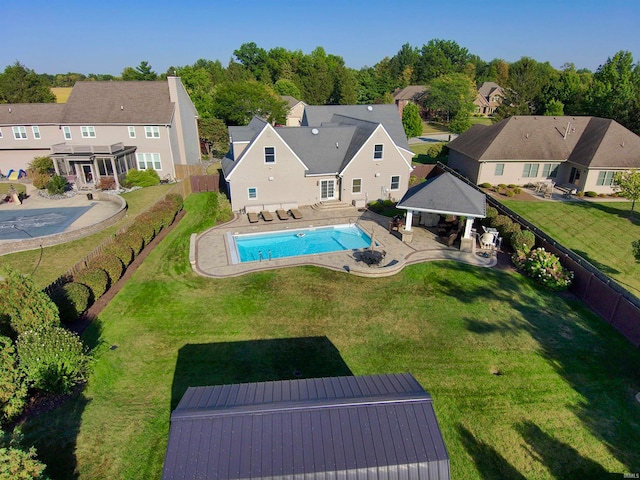 view of swimming pool with a patio, a gazebo, and a yard