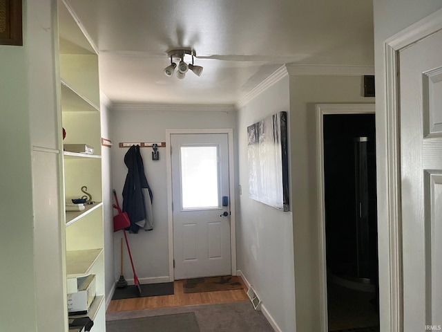 interior space featuring ornamental molding and dark hardwood / wood-style floors