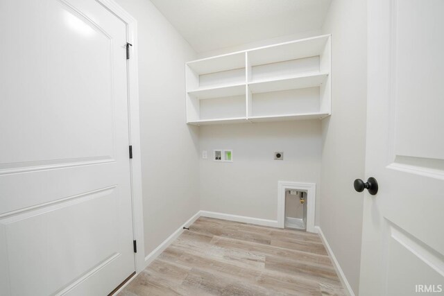 washroom with washer hookup, light wood-type flooring, and electric dryer hookup