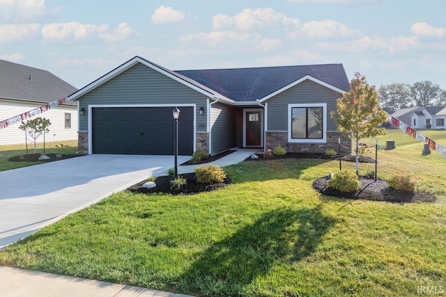 view of front of home featuring a front yard and a garage